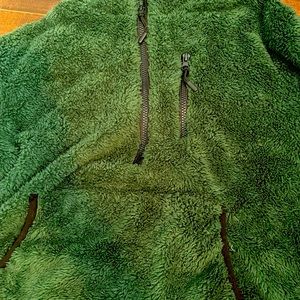 a green sweater half zip!